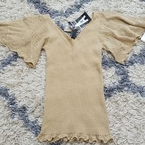 A Star Knit Top with Butterfly Crocheted Sleeves